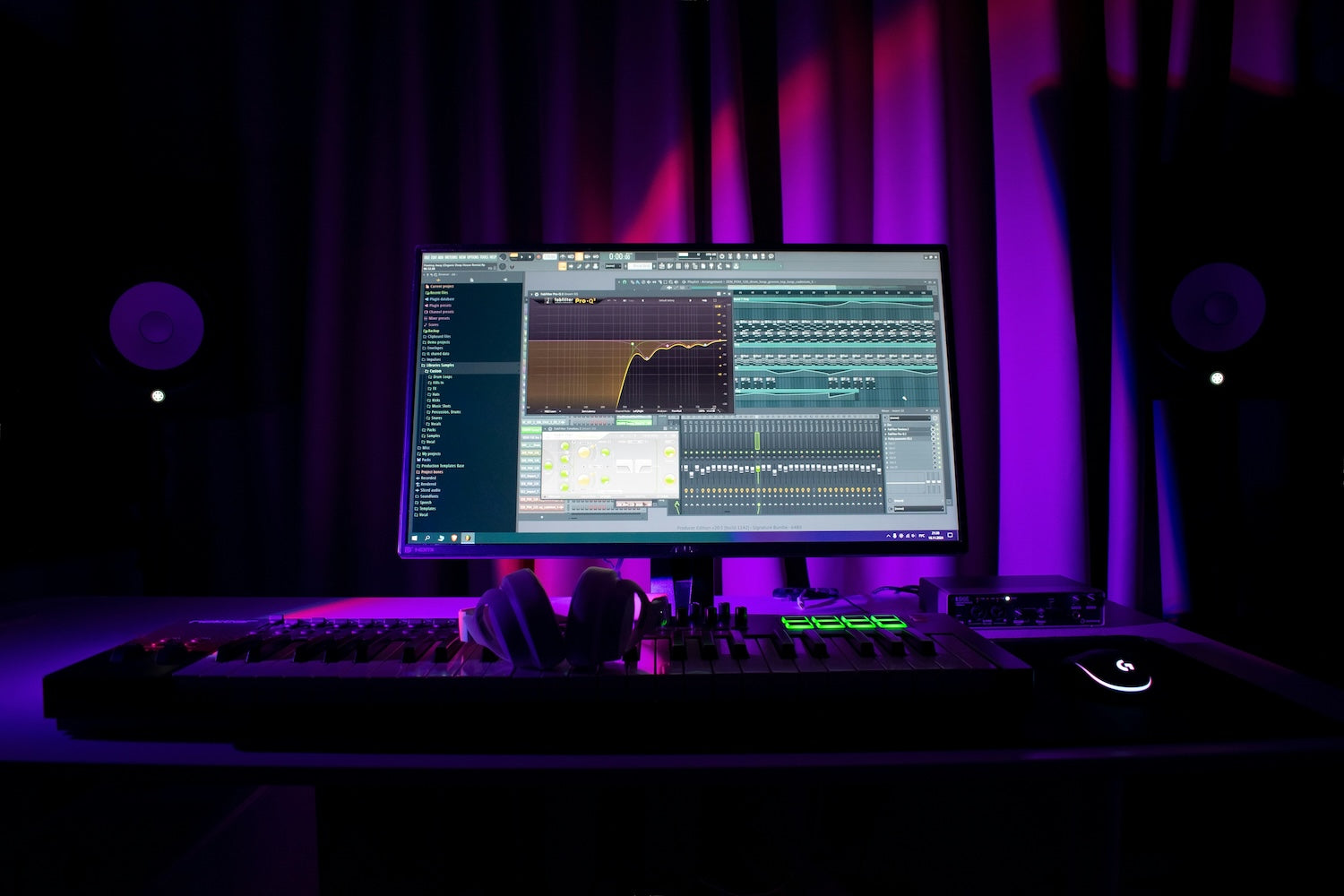 A beginner producer working at a laptop with headphones, starting a new electronic music session