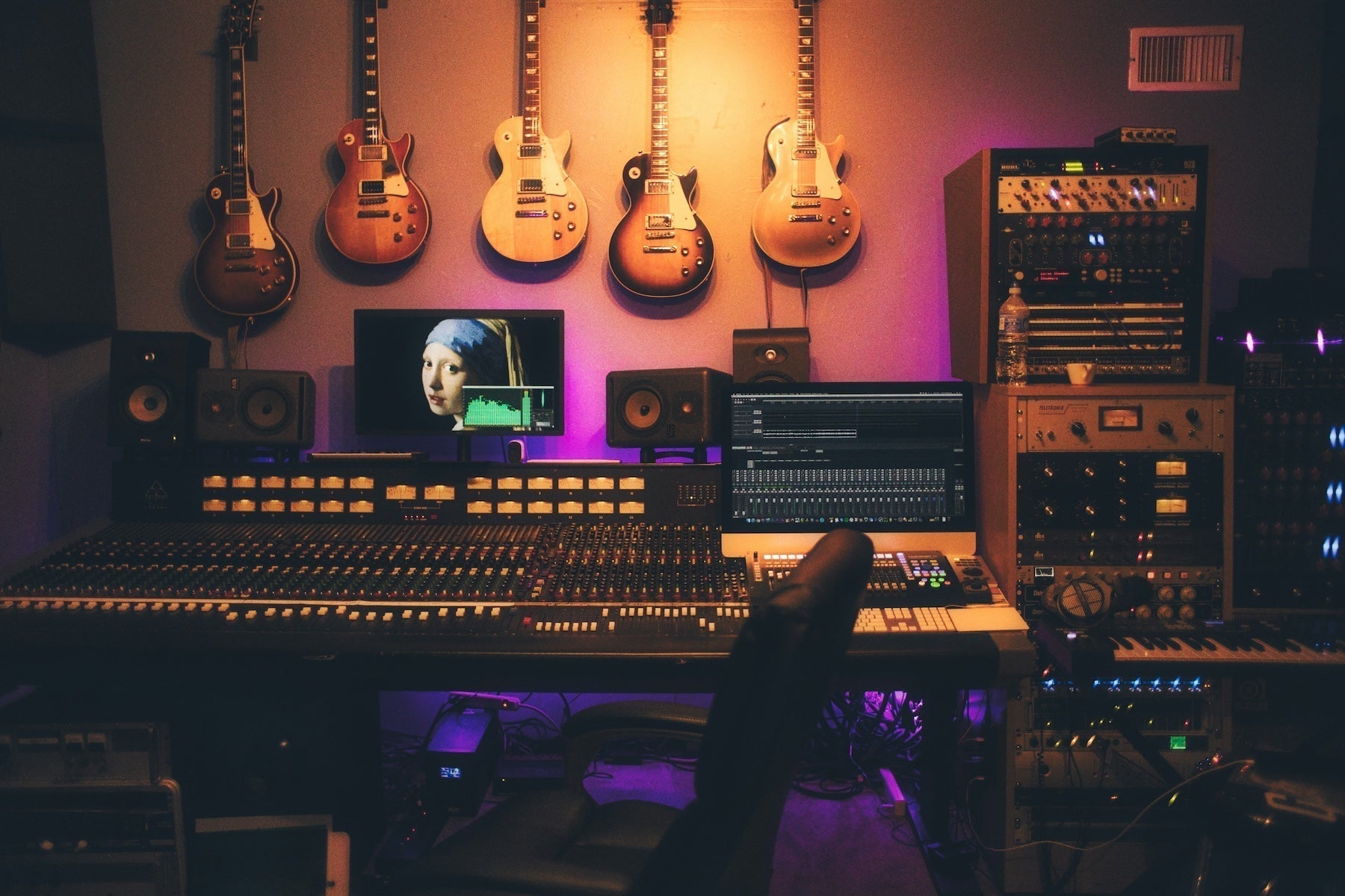 Studio workstation with a soft synth open mid-patch during a subtractive synthesis session