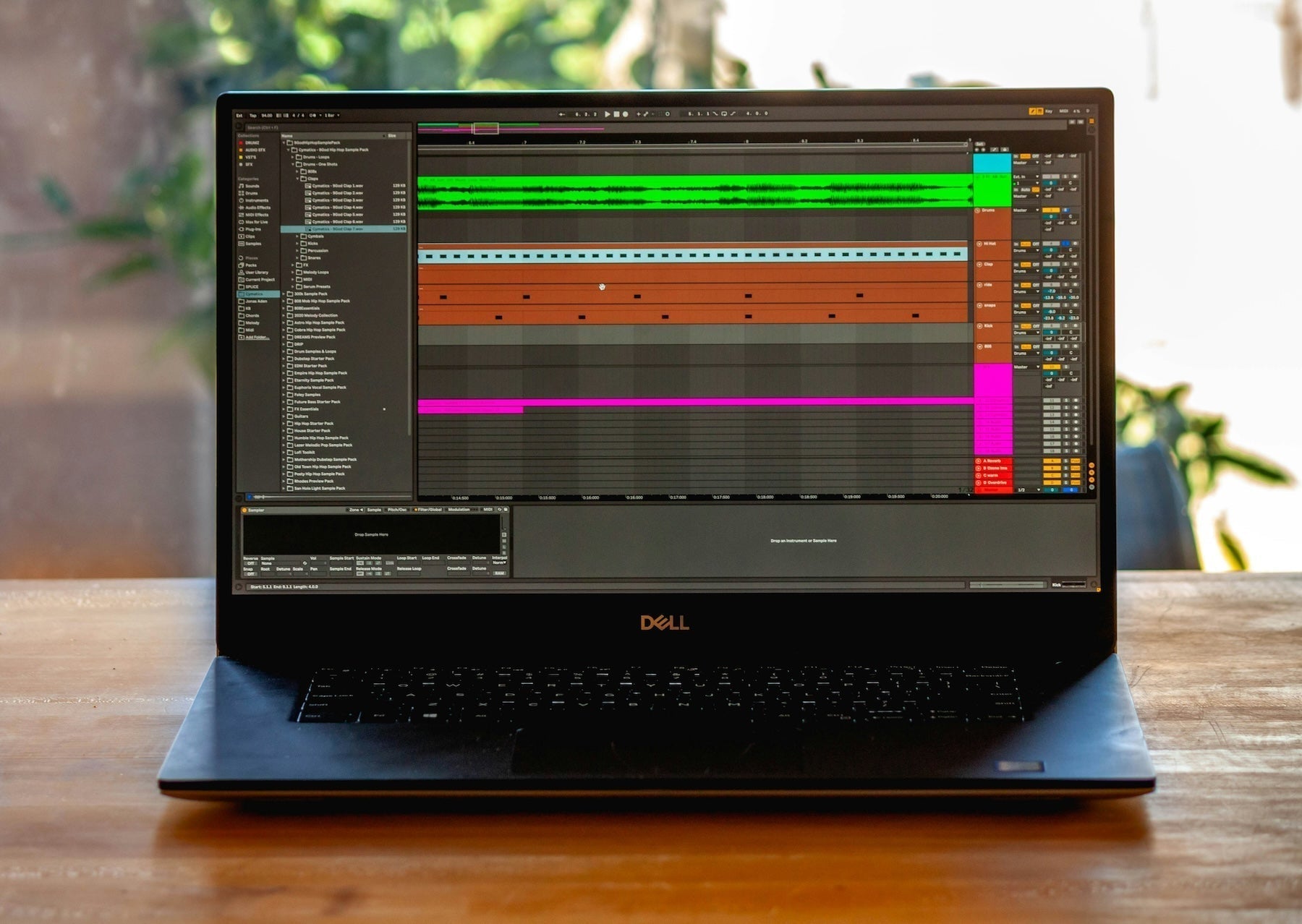 Subwoofer and studio monitors with a dubstep session loaded showing layered bass tracks