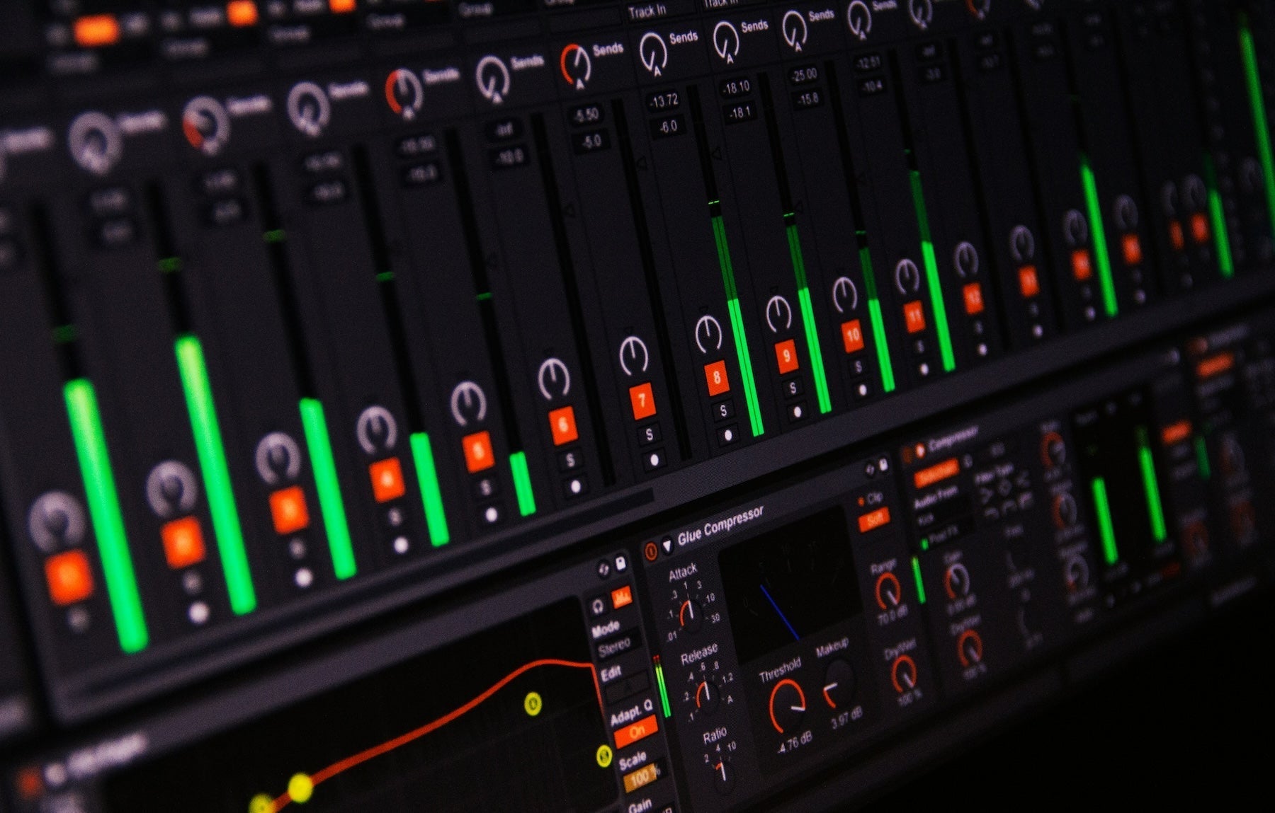 Producer browsing sample folders on a laptop in a home studio setup