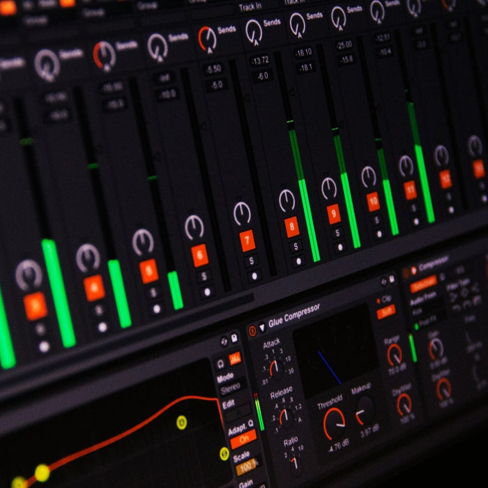 Producer browsing sample folders on a laptop in a home studio setup