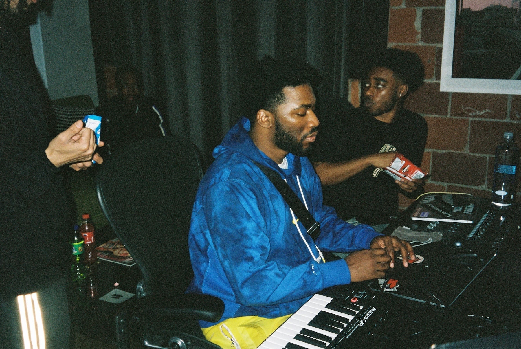 Producer reviewing track metadata and sample sources at their workstation