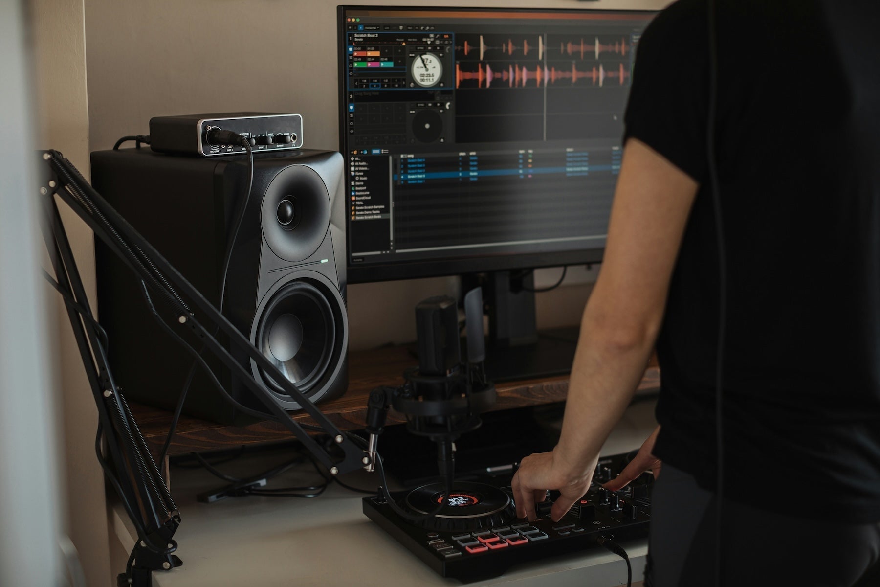 A producer routing sends and returns at their mixing workstation