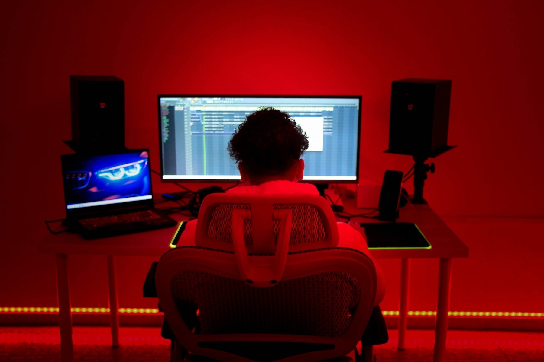 Producer adjusting groove and swing settings on an MPC-style drum pad controller